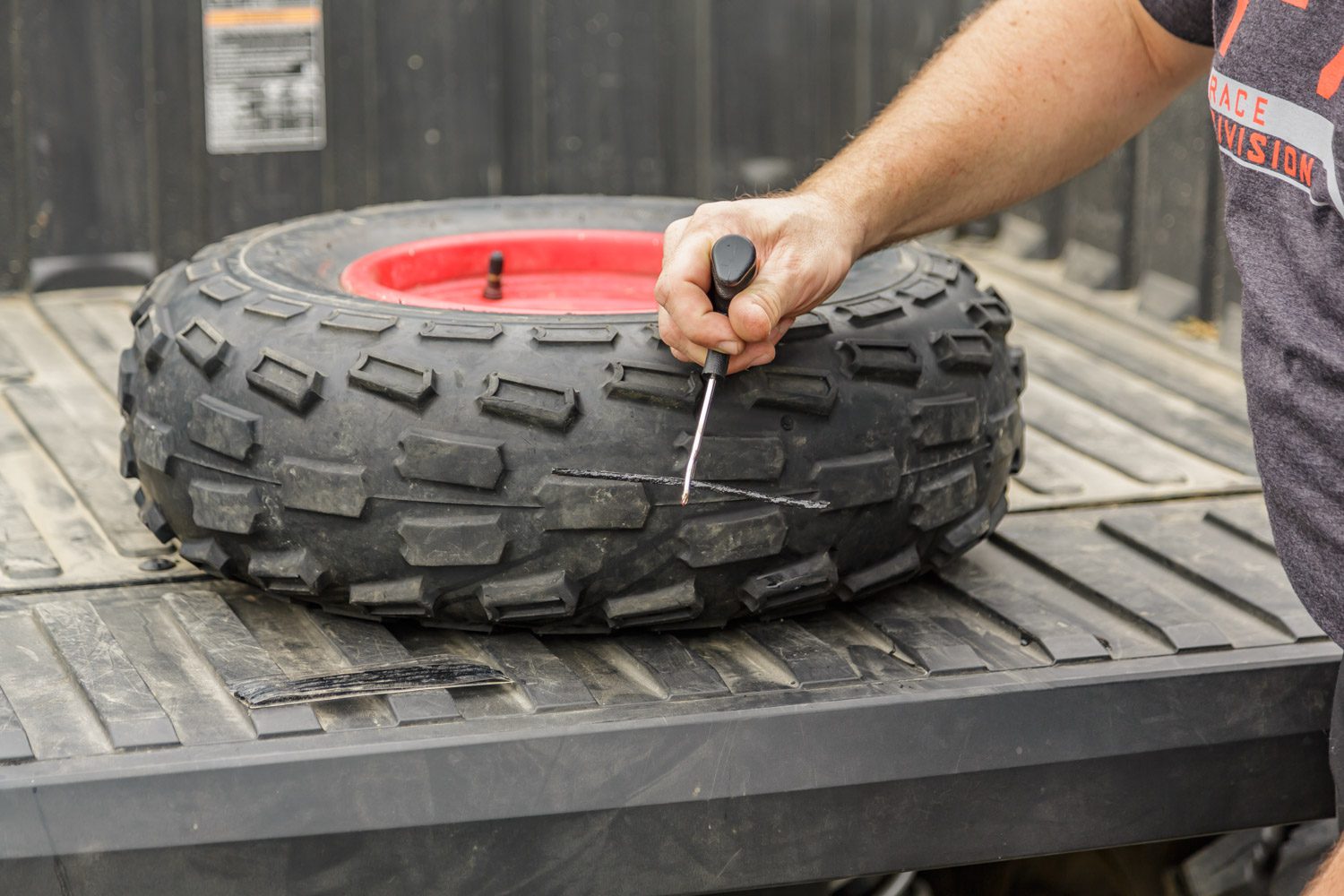 Repairing a flat tire while on the trail