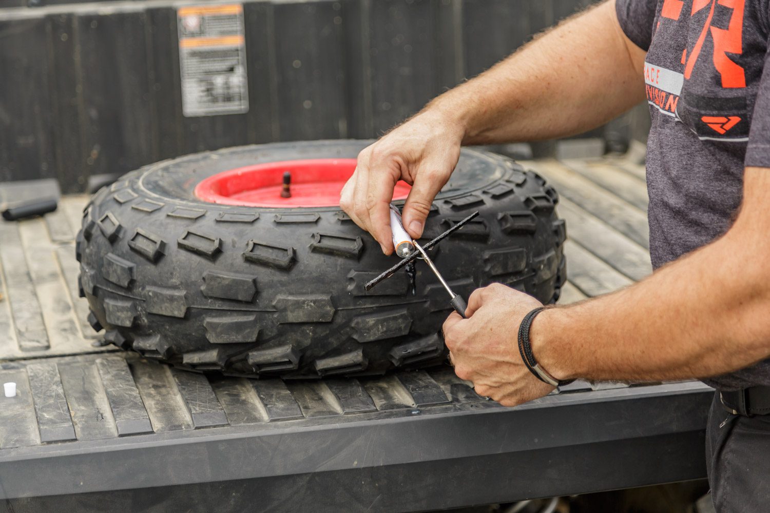 Repairing a flat tire while on the trail