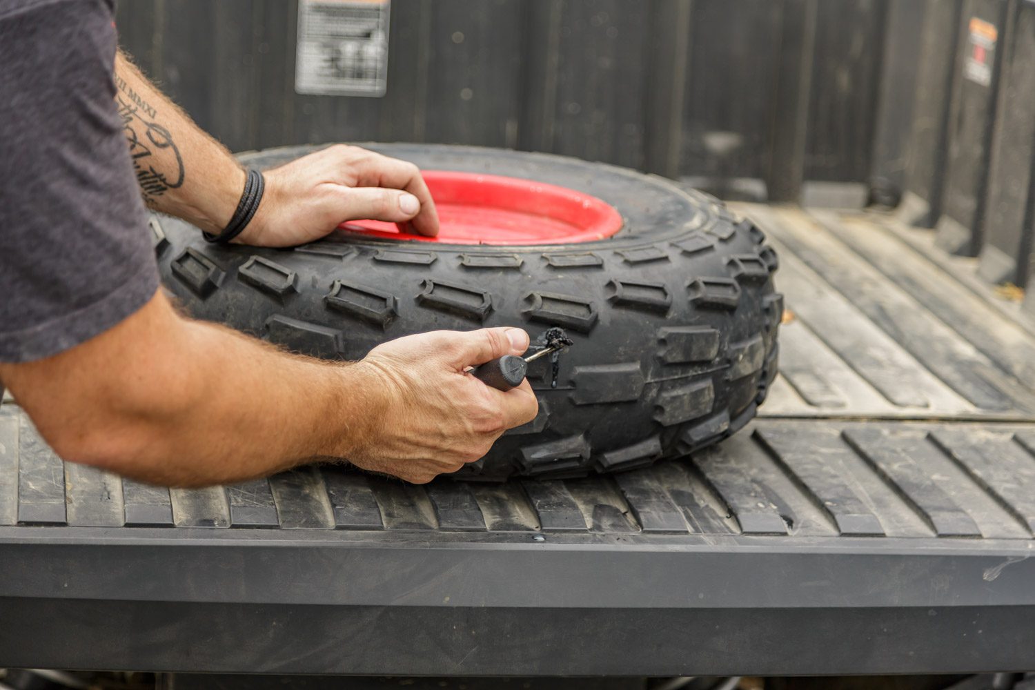 Repairing a flat tire while on the trail